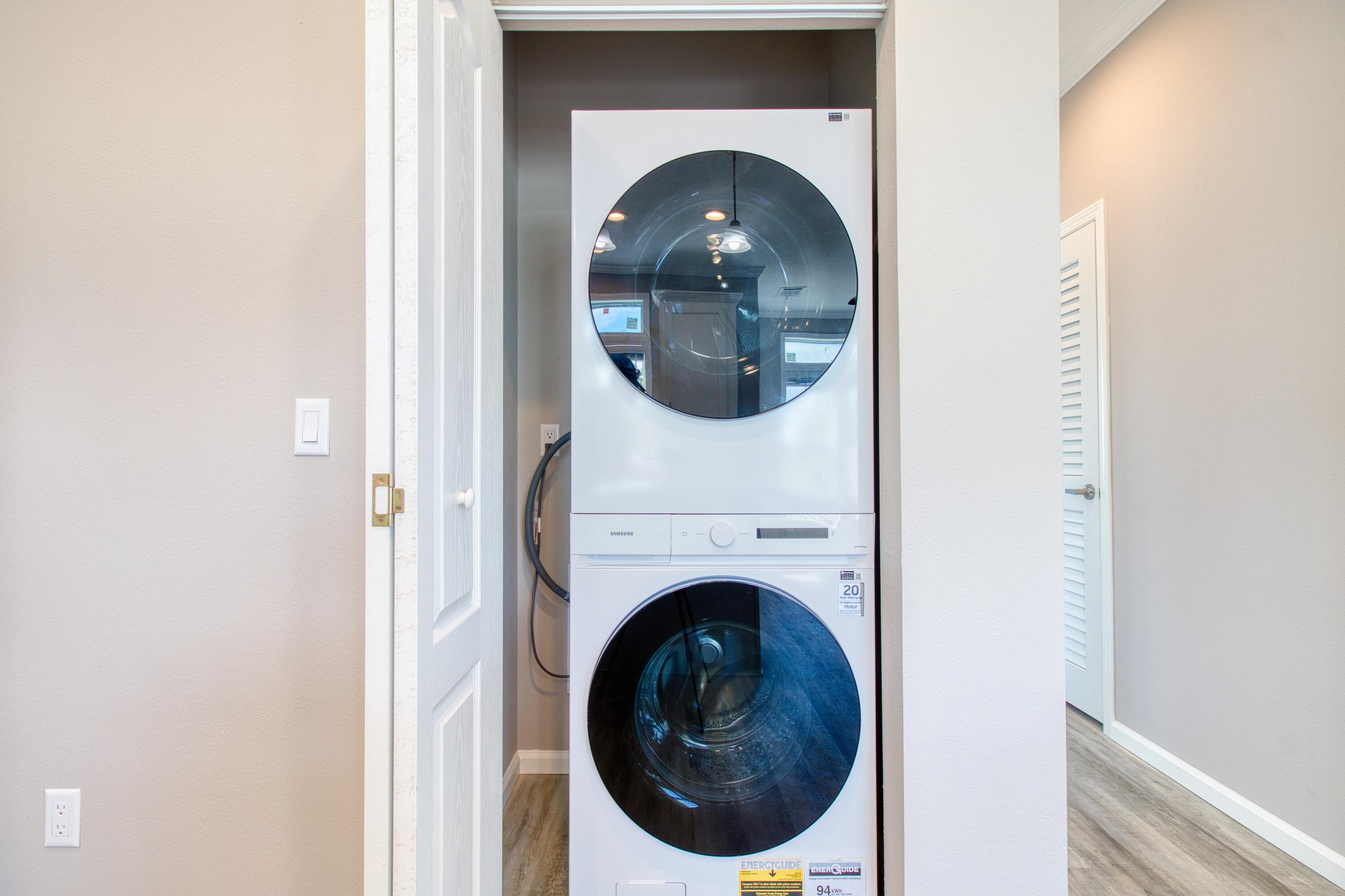 10701 South Ocean Drive, Unit 613 Jensen Beach, FL 34957 - Photo 21 of 64 a close view of a utility room with dryer and washer