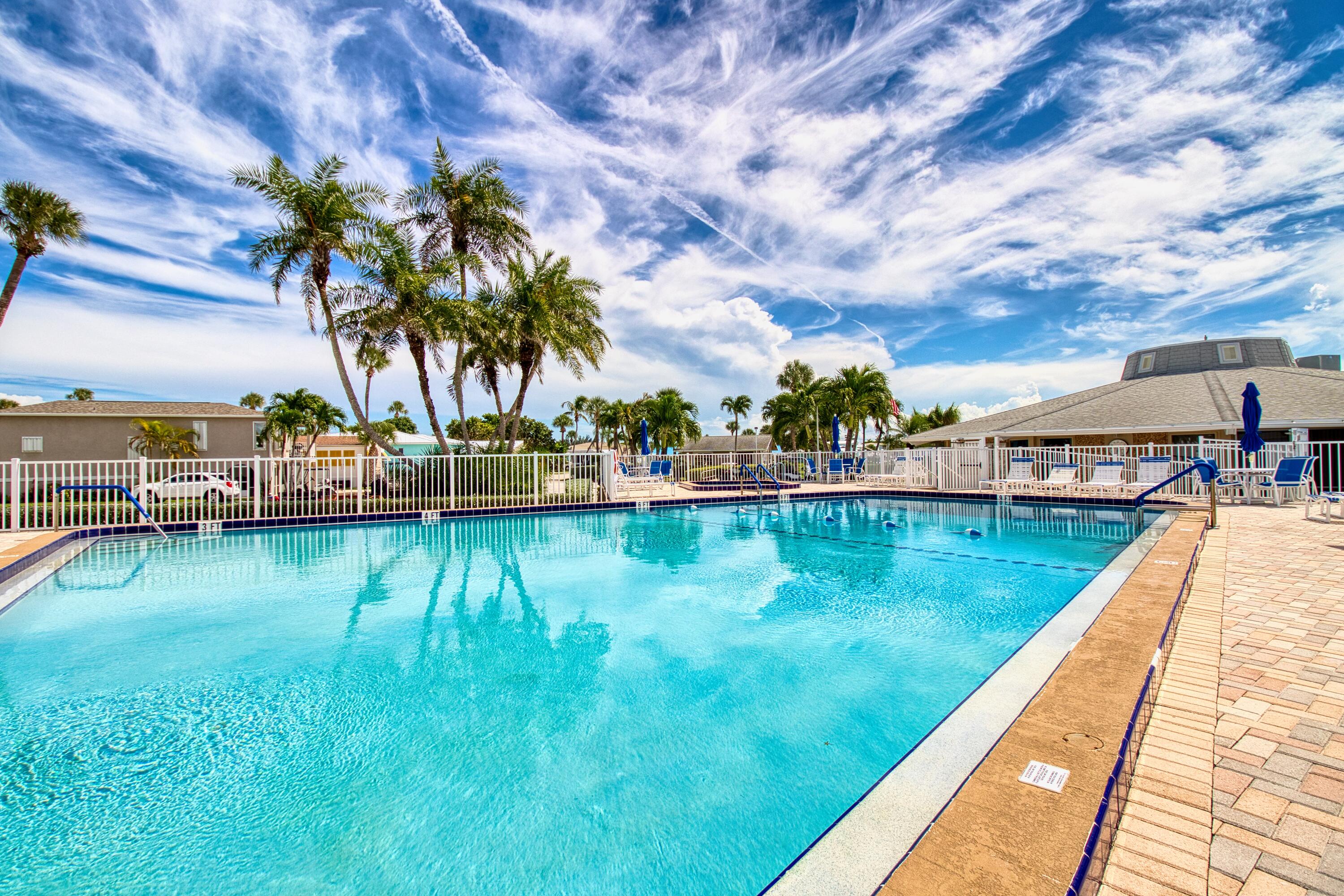 10701 South Ocean Drive, Unit 613 Jensen Beach, FL 34957 - Photo 31 of 64 a view of swimming pool with a yard