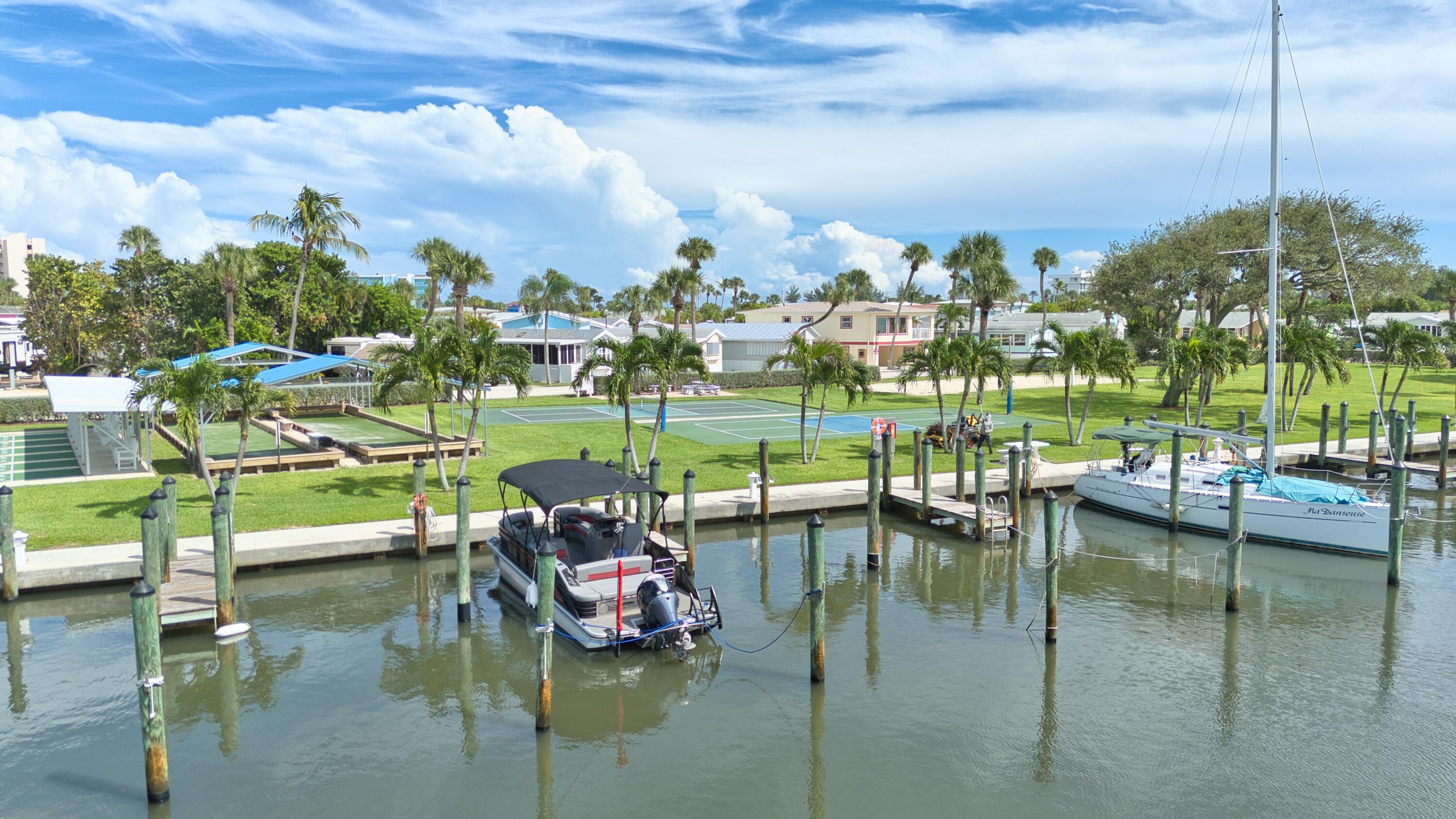 10701 South Ocean Drive, Unit 613 Jensen Beach, FL 34957 - Photo 35 of 64 a view of a lake with a house