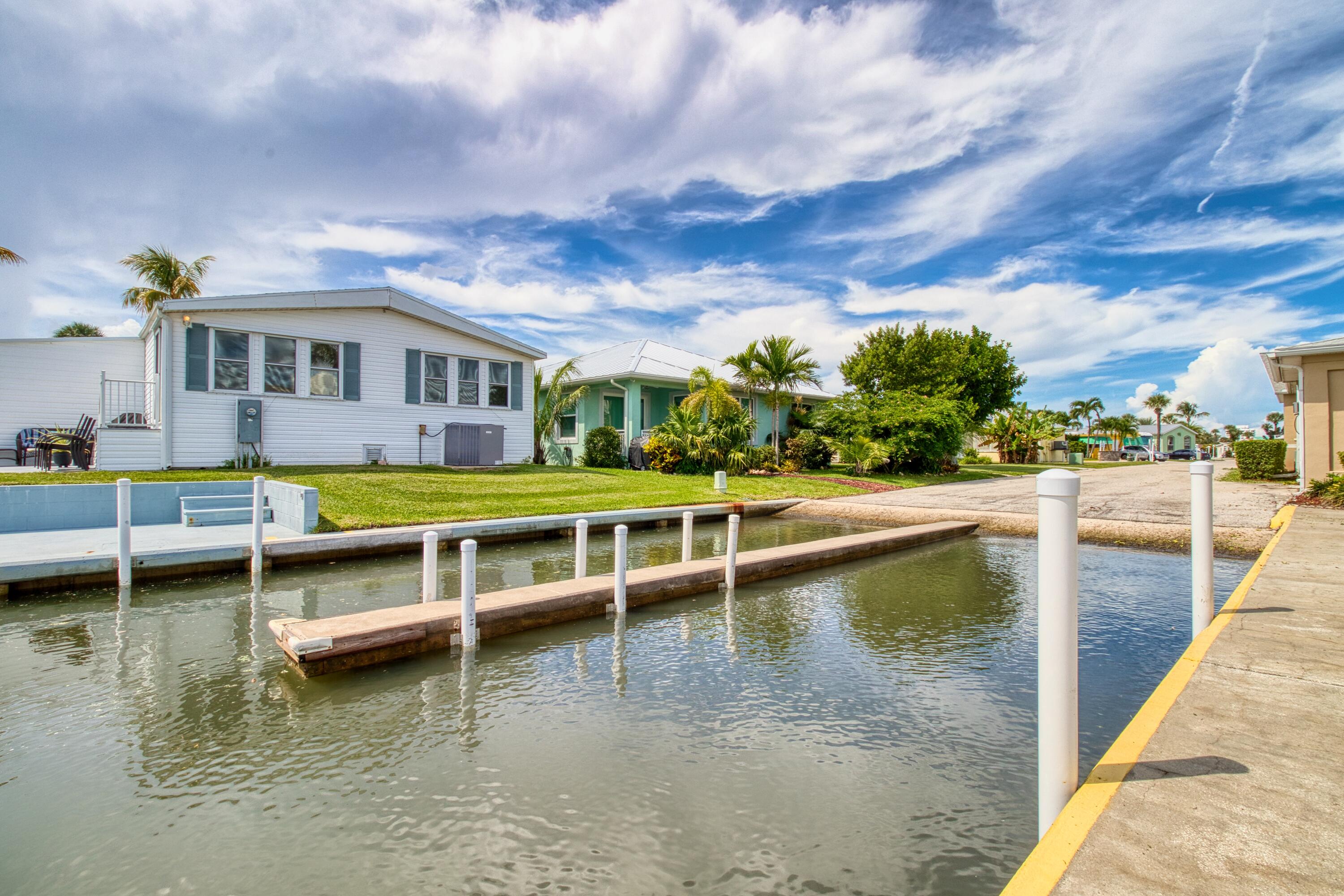 10701 South Ocean Drive, Unit 613 Jensen Beach, FL 34957 - Photo 40 of 64 a view of a swimming pool with outdoor seating