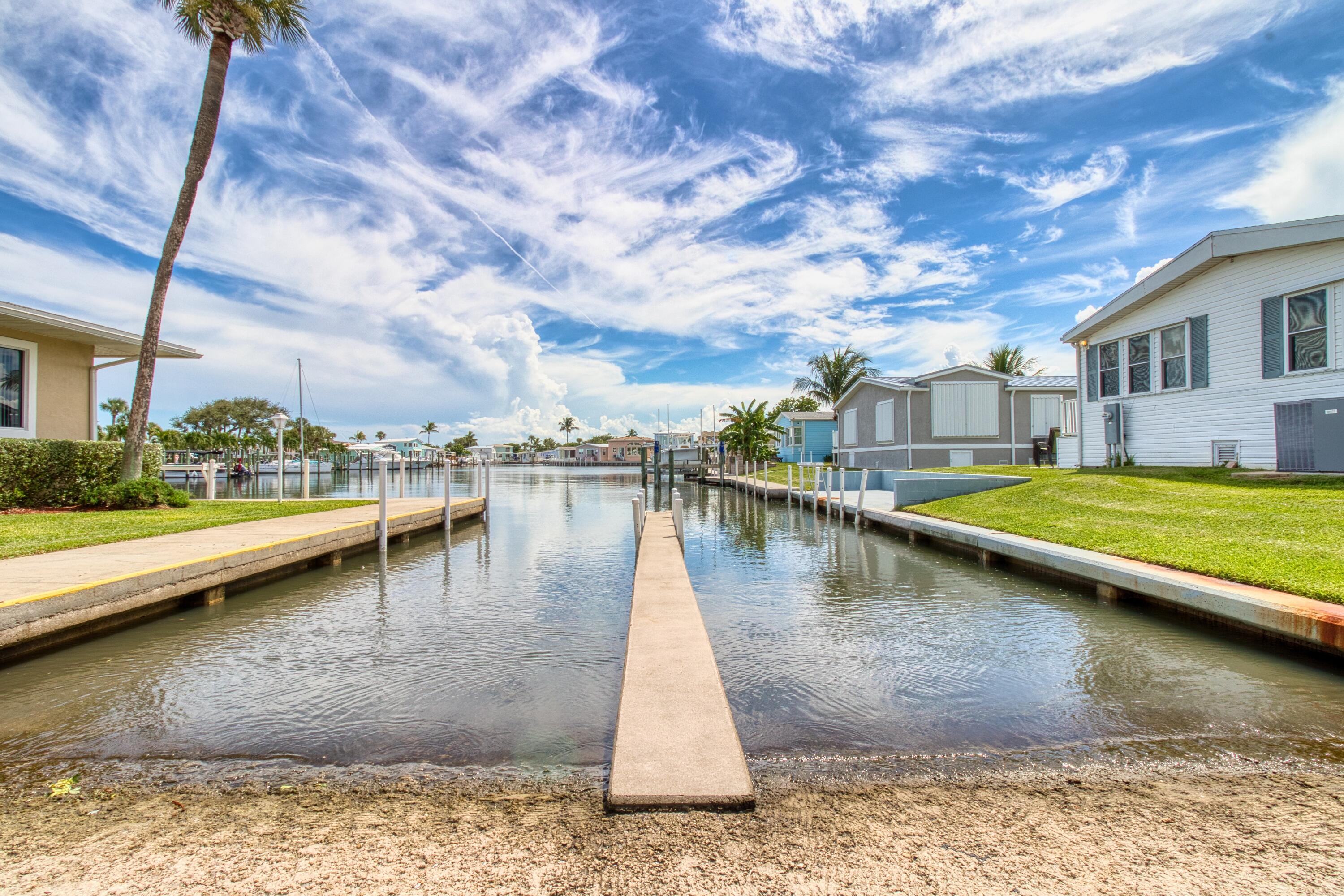10701 South Ocean Drive, Unit 613 Jensen Beach, FL 34957 - Photo 41 of 64 a view of swimming pool with outdoor seating