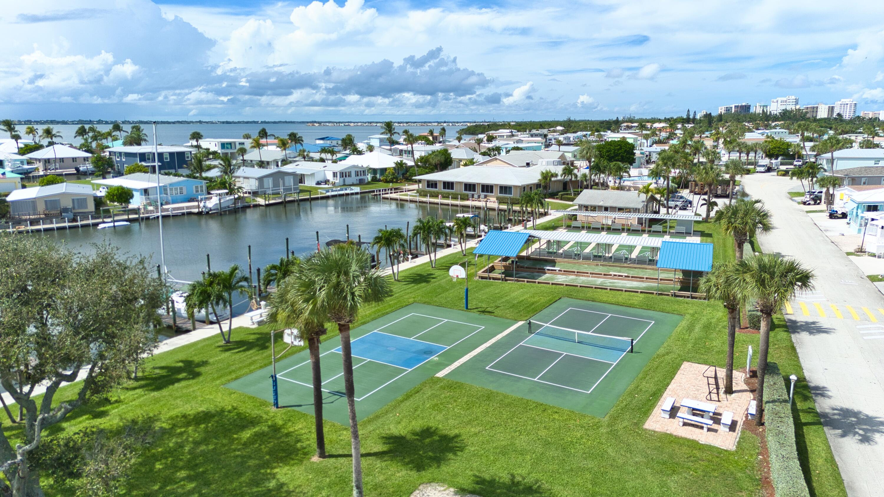 10701 South Ocean Drive, Unit 613 Jensen Beach, FL 34957 - Photo 42 of 64 a view of a lake with a building in the background