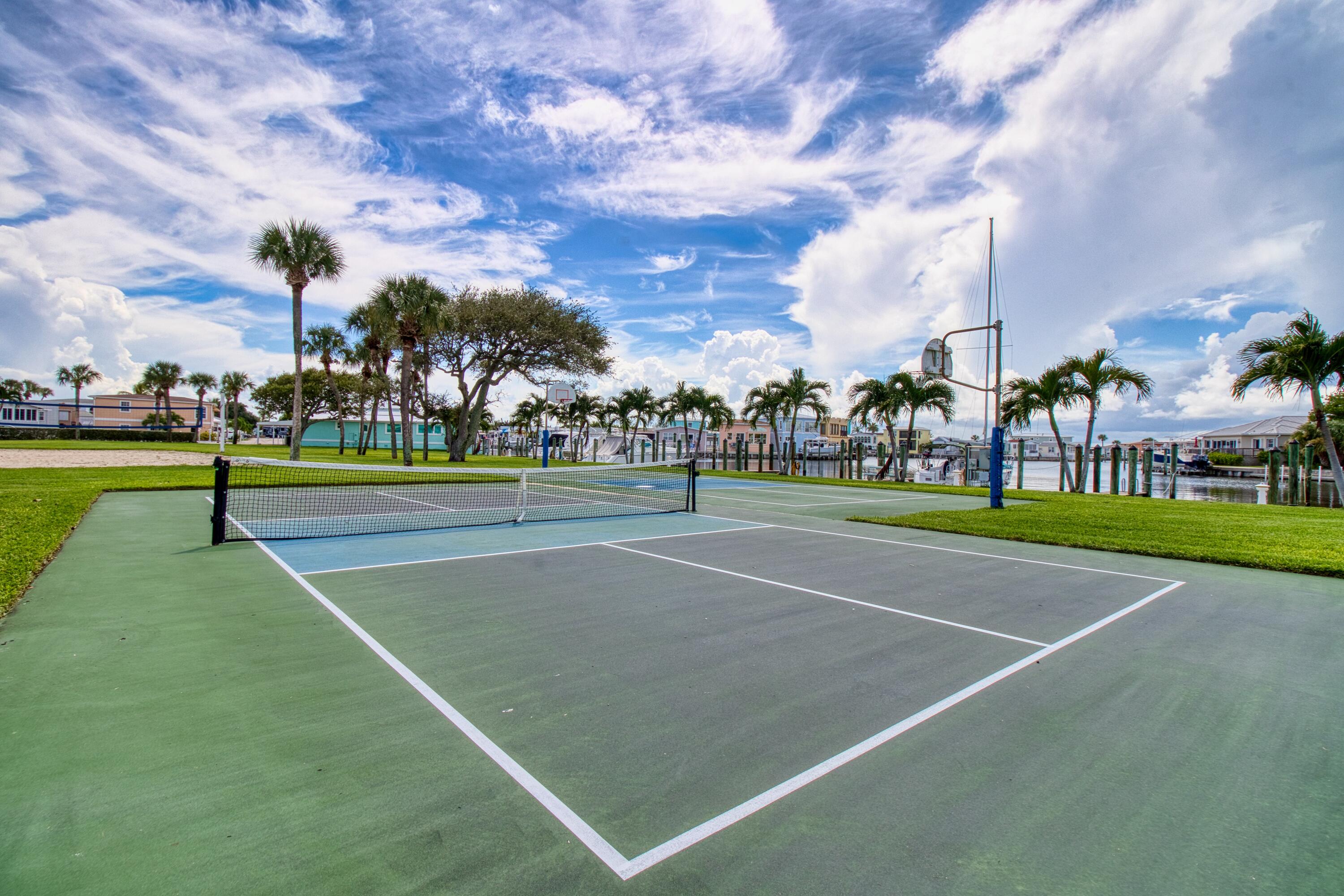 10701 South Ocean Drive, Unit 613 Jensen Beach, FL 34957 - Photo 43 of 64 a view of a tennis court