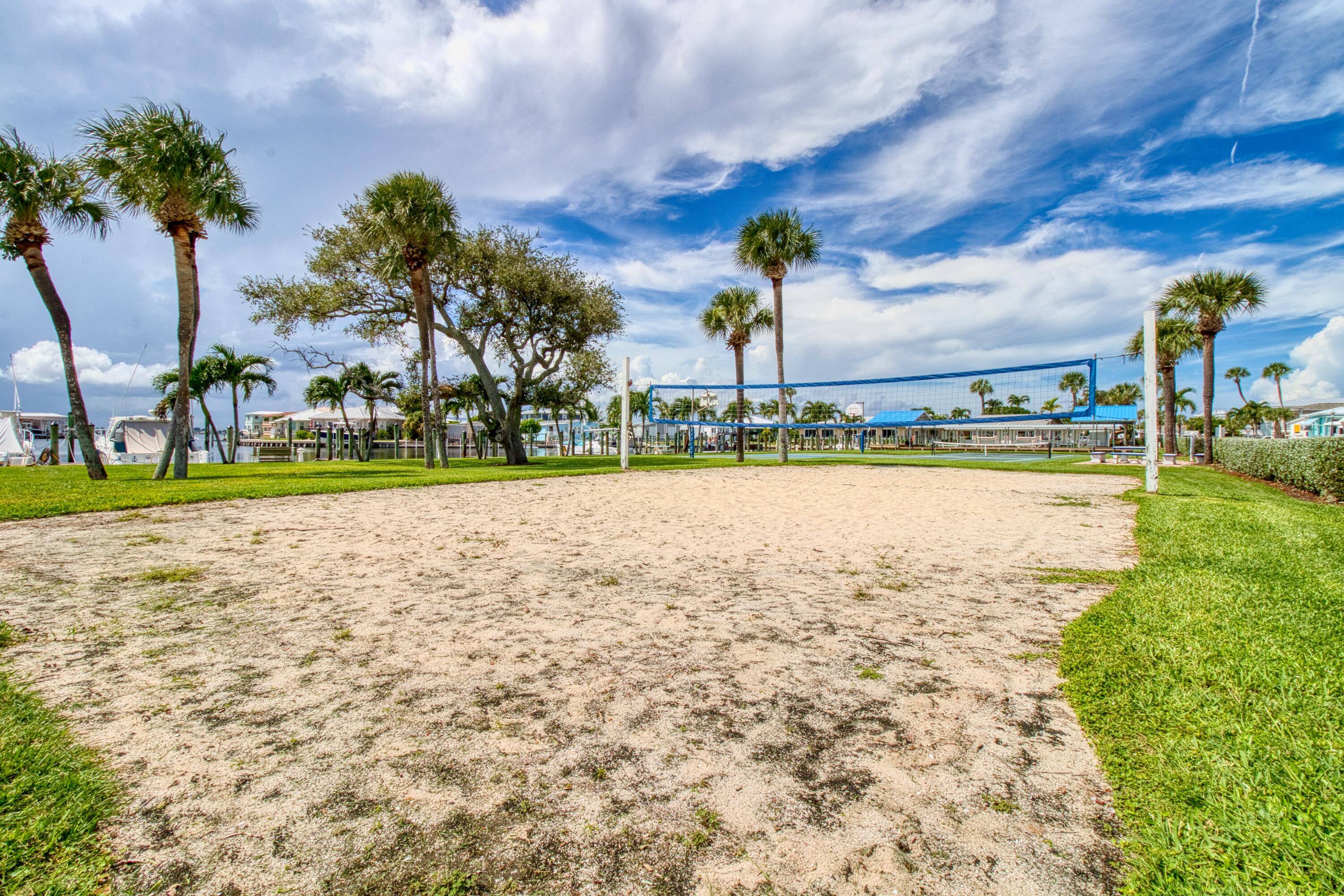 10701 South Ocean Drive, Unit 613 Jensen Beach, FL 34957 - Photo 45 of 64 a view of a lake with houses in background