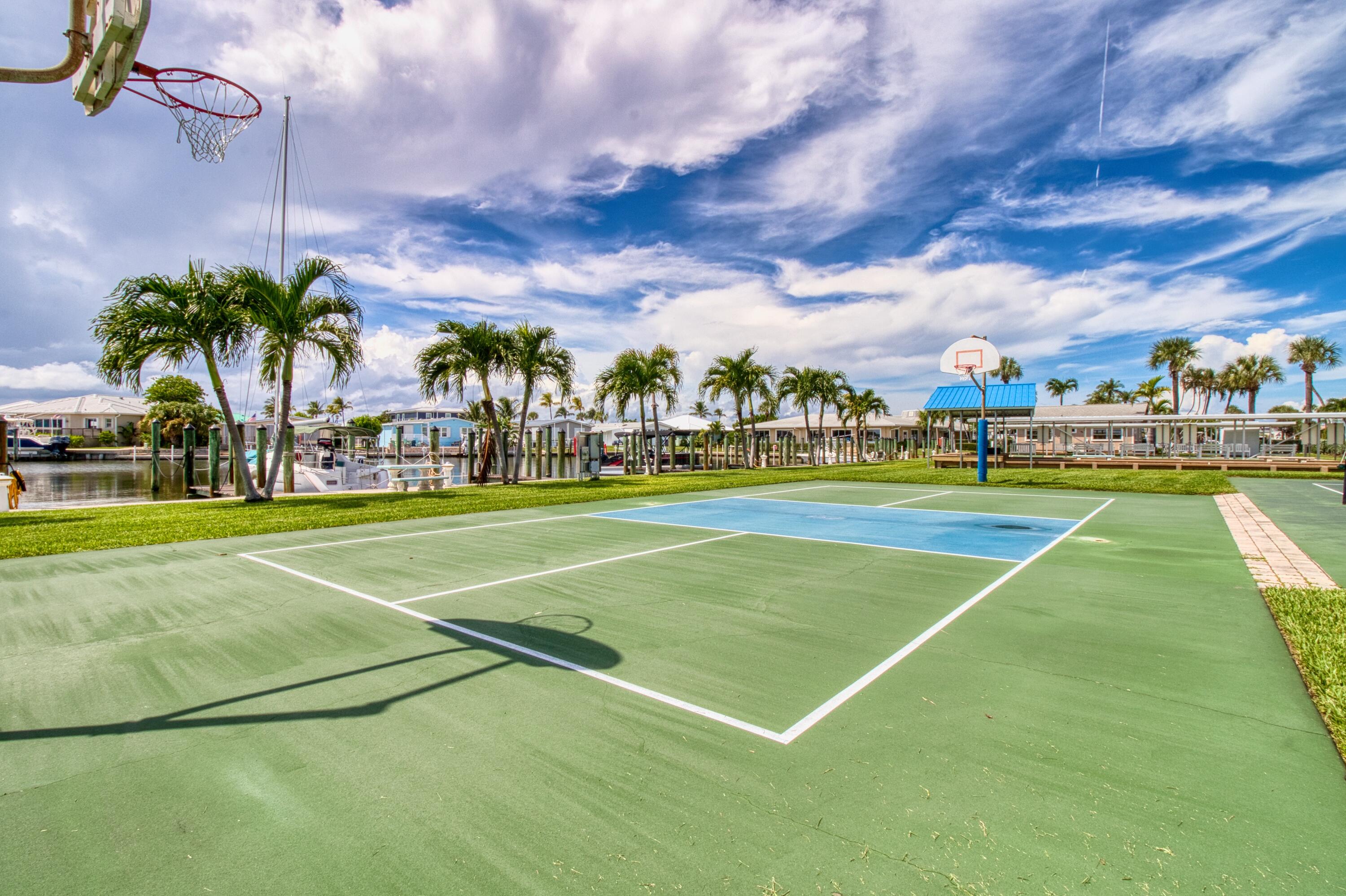 10701 South Ocean Drive, Unit 613 Jensen Beach, FL 34957 - Photo 46 of 64 a view of a tennis court