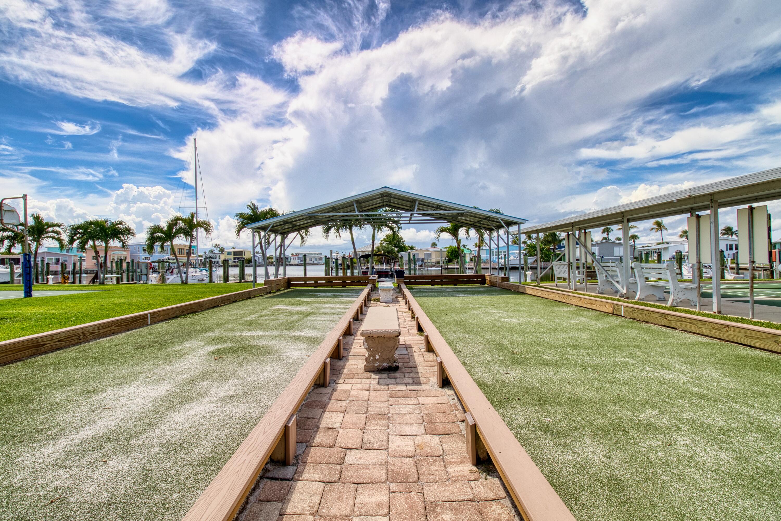 10701 South Ocean Drive, Unit 613 Jensen Beach, FL 34957 - Photo 49 of 64 a view of swimming pool in front of residential houses with city view