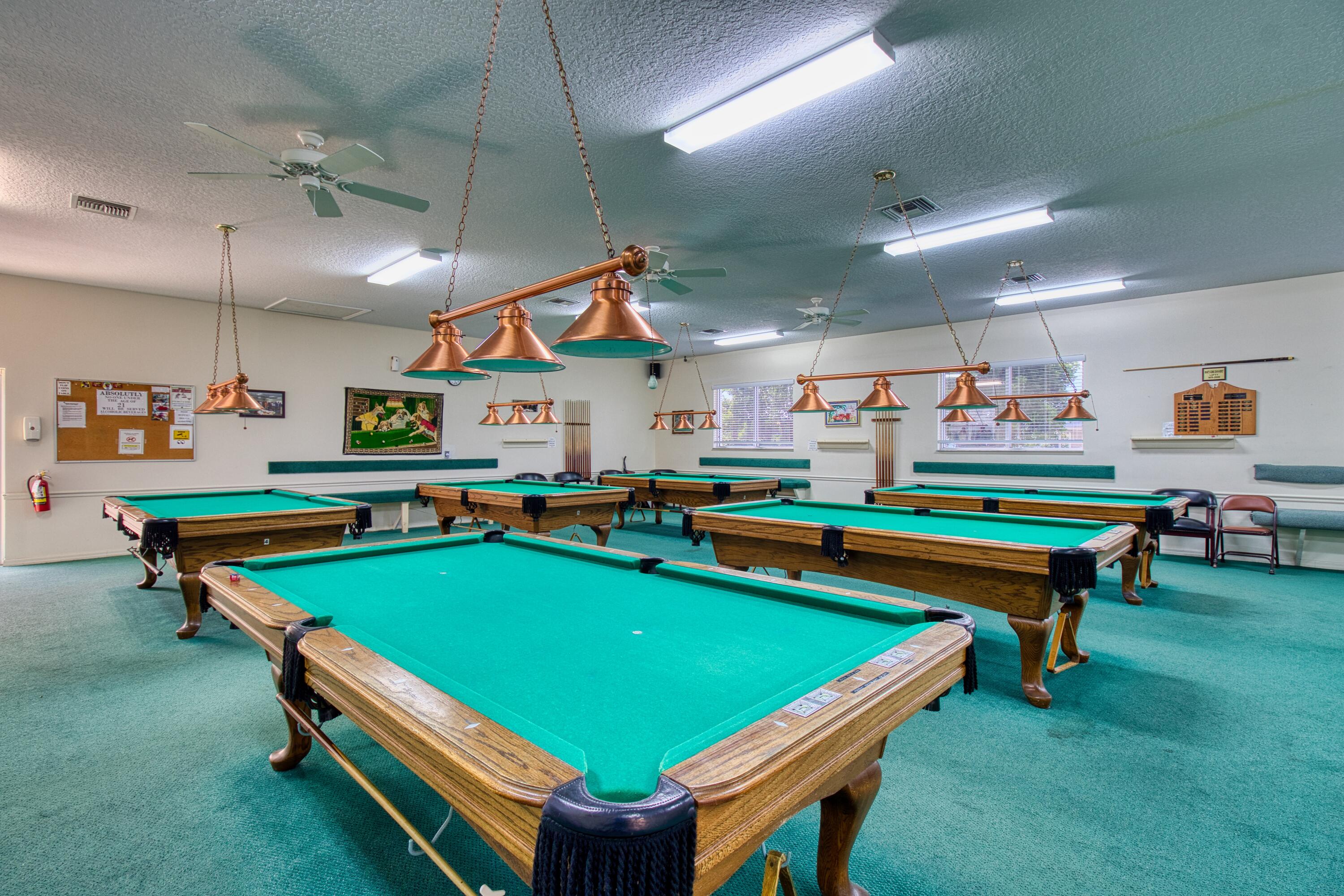 10701 South Ocean Drive, Unit 613 Jensen Beach, FL 34957 - Photo 50 of 64 a room with pool table and windows