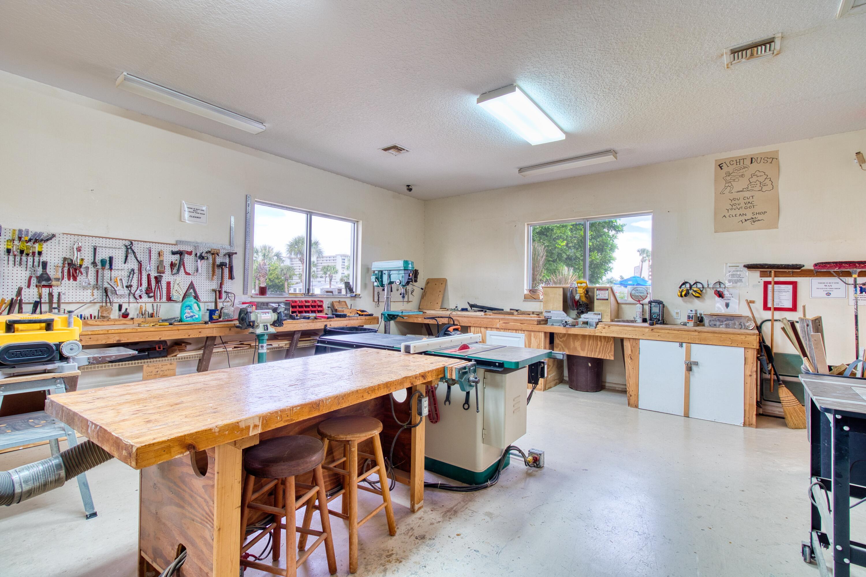10701 South Ocean Drive, Unit 613 Jensen Beach, FL 34957 - Photo 54 of 64 a kitchen with lots of counter top space and painting on the wall