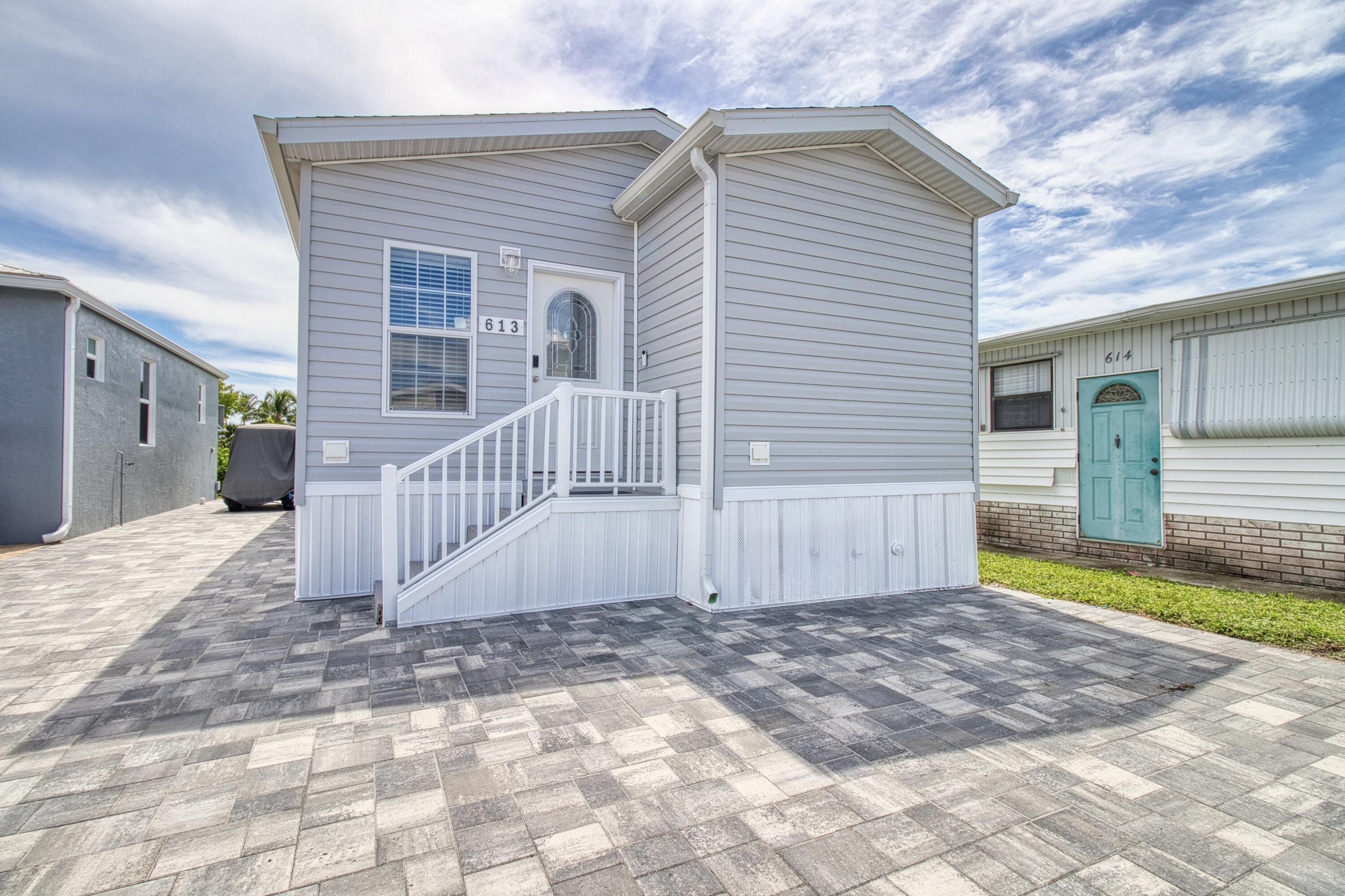 10701 South Ocean Drive, Unit 613 Jensen Beach, FL 34957 - Photo 64 of 64 a view of a house with a yard