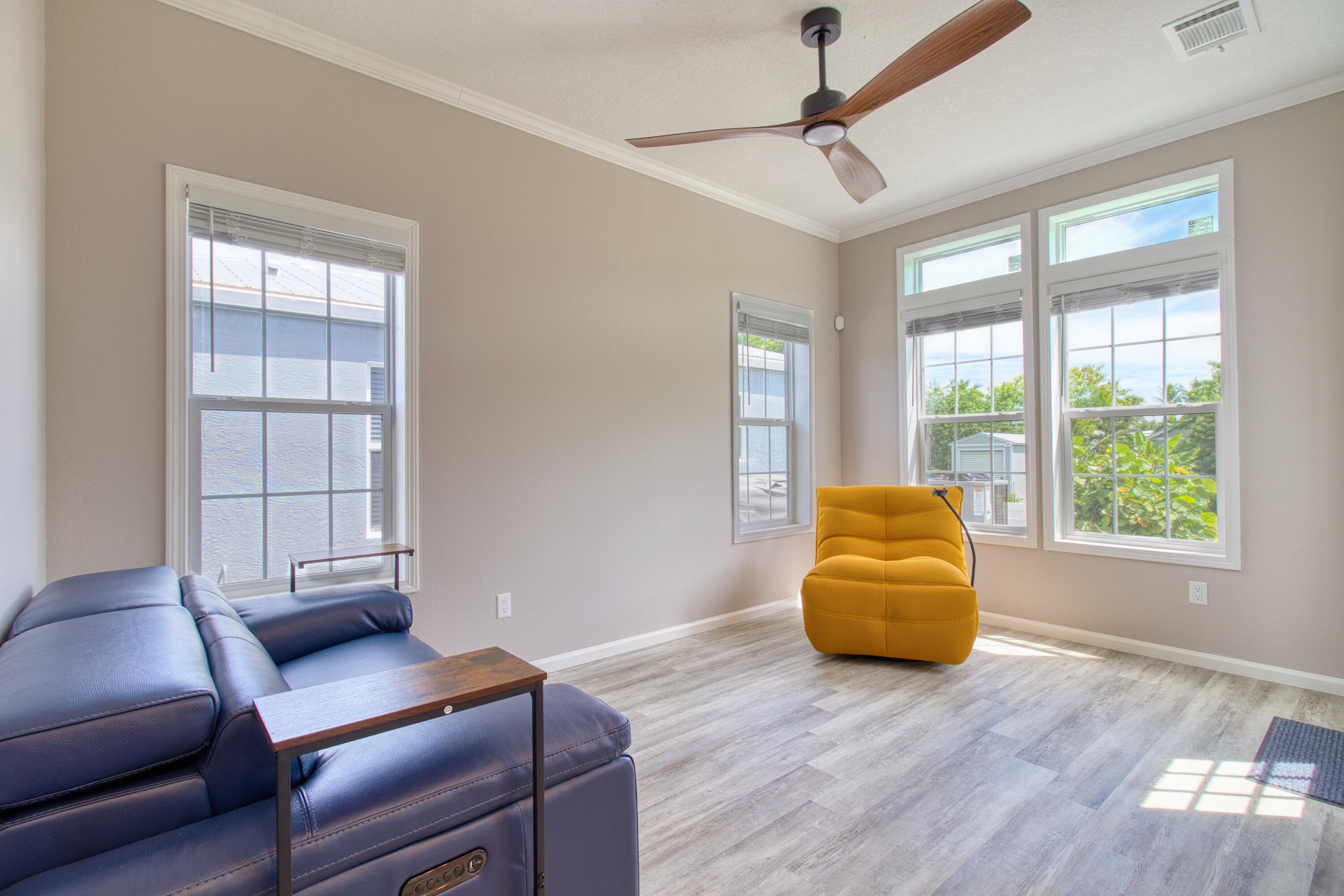 10701 South Ocean Drive, Unit 613 Jensen Beach, FL 34957 - Photo 9 of 64 a living room with furniture and a window