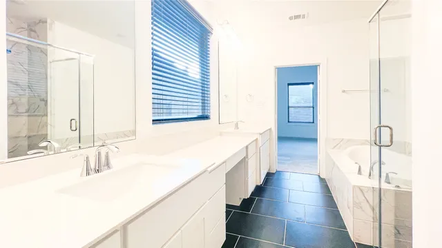 a bathroom with a bathtub and a sink