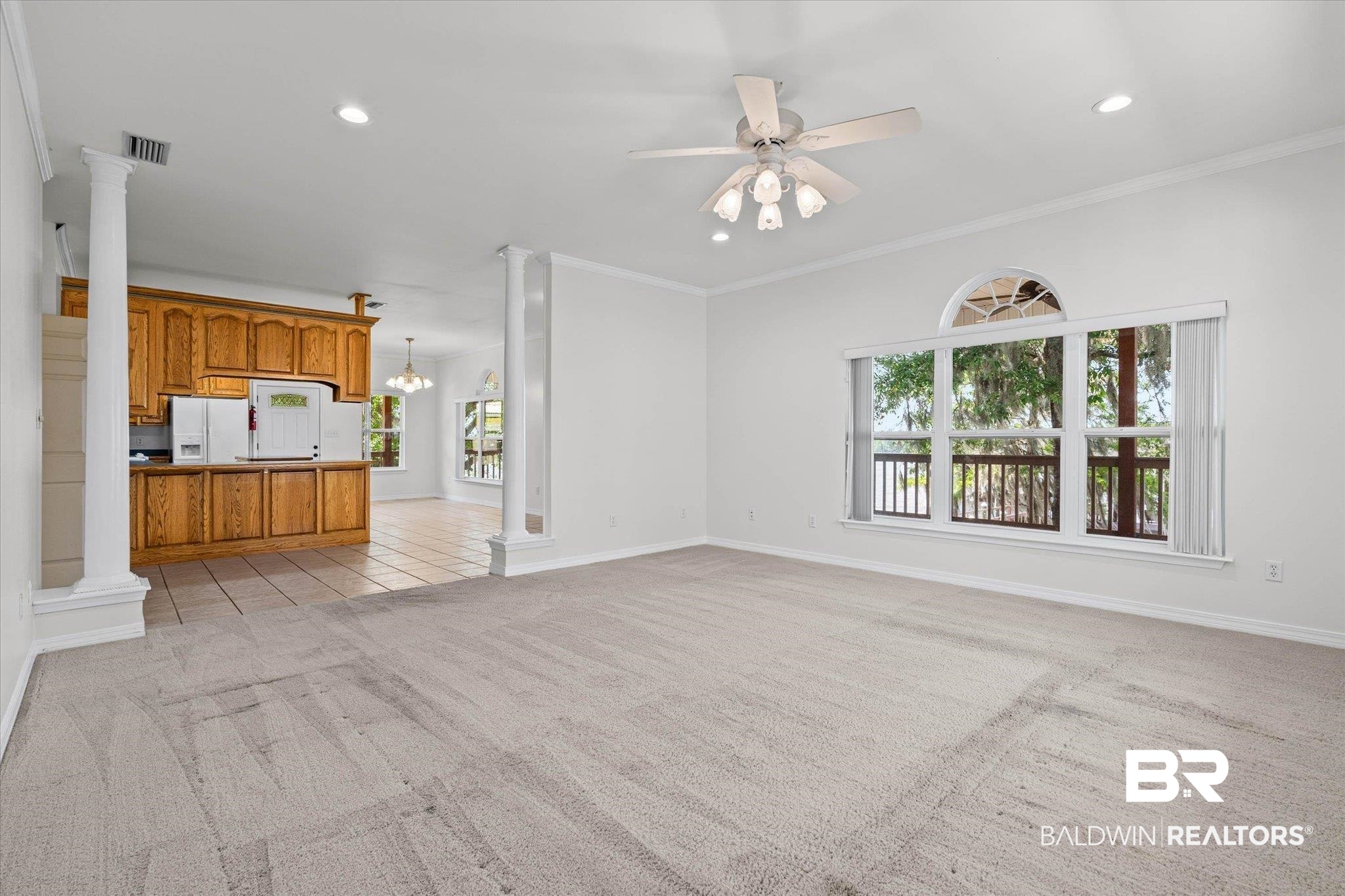 41923 Bayou Road Bay Minette, AL 36507 - Photo 3 of 35 Spacious living area featuring light-toned carpeting, crown molding, and recessed lighting