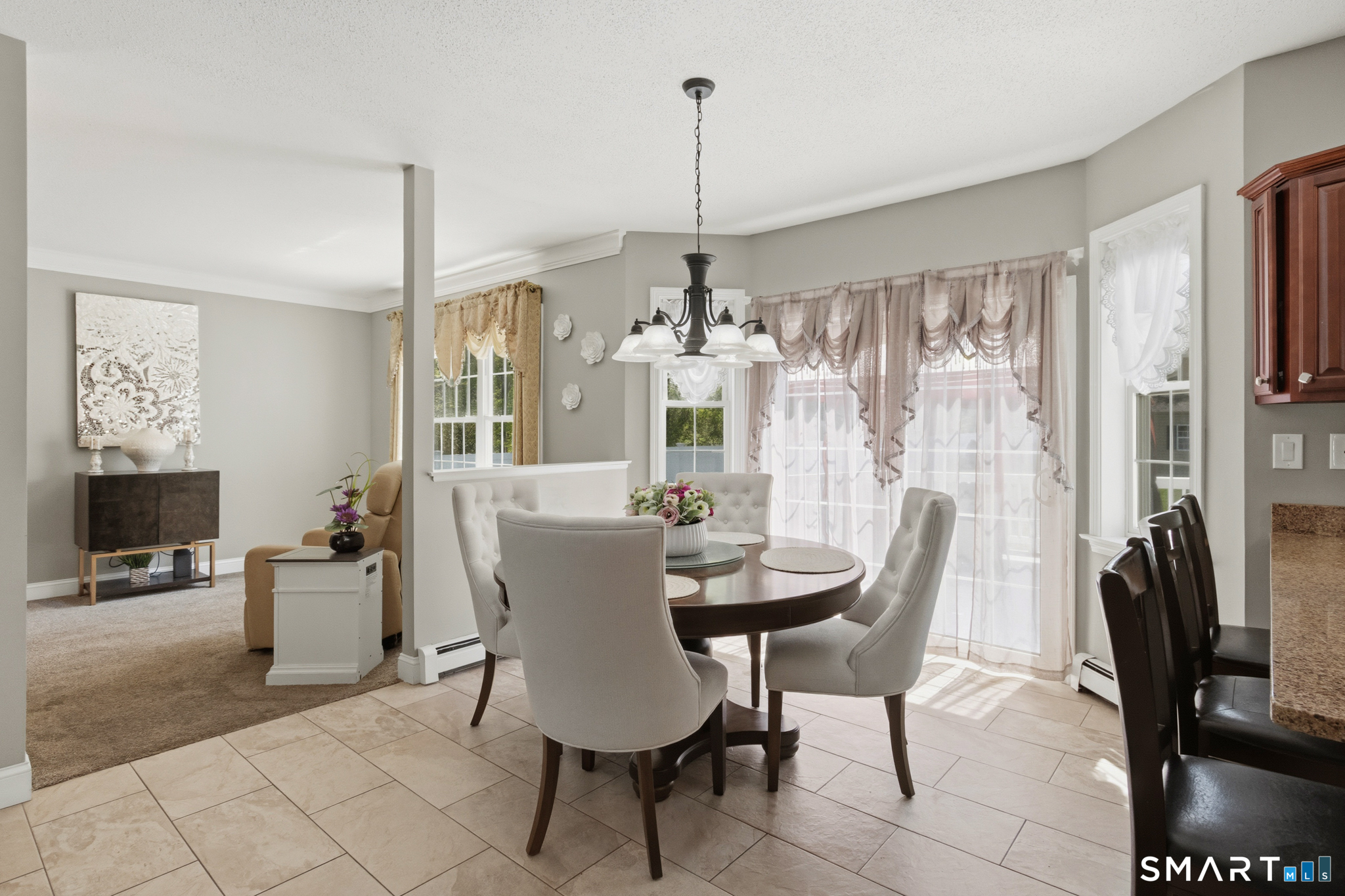 5 Ice Pond Road Granby, CT 06035 - Photo 12 of 40 a dining room with furniture a chandelier and window