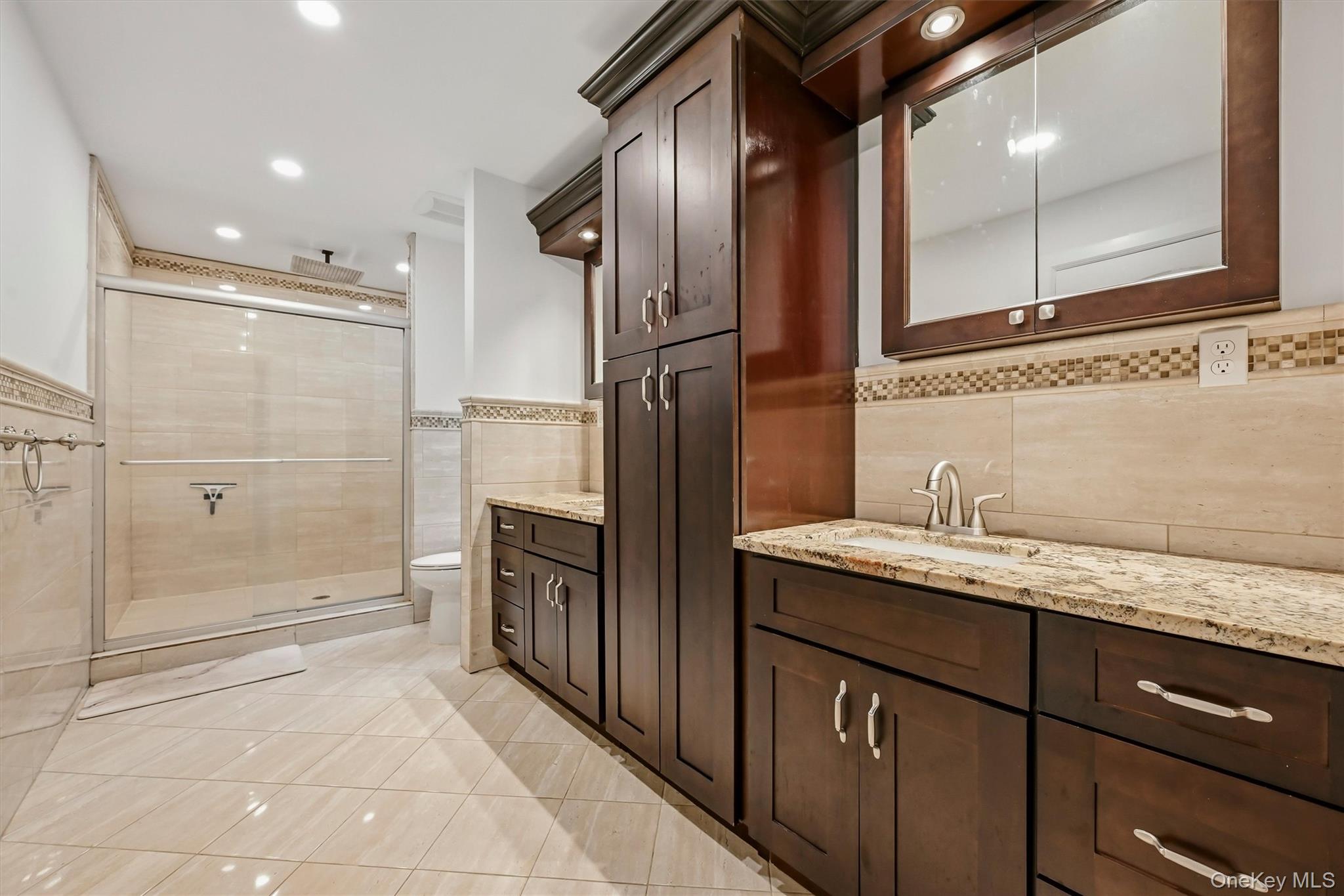 8 Darmstadter Road Bloomingburg, NY 12721 - Photo 24 of 47 Primary bathroom with granite vanities, marble tile oversized shower with rainfall shower head. WIC access in primary bath.