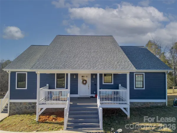a front view of a house with a porch