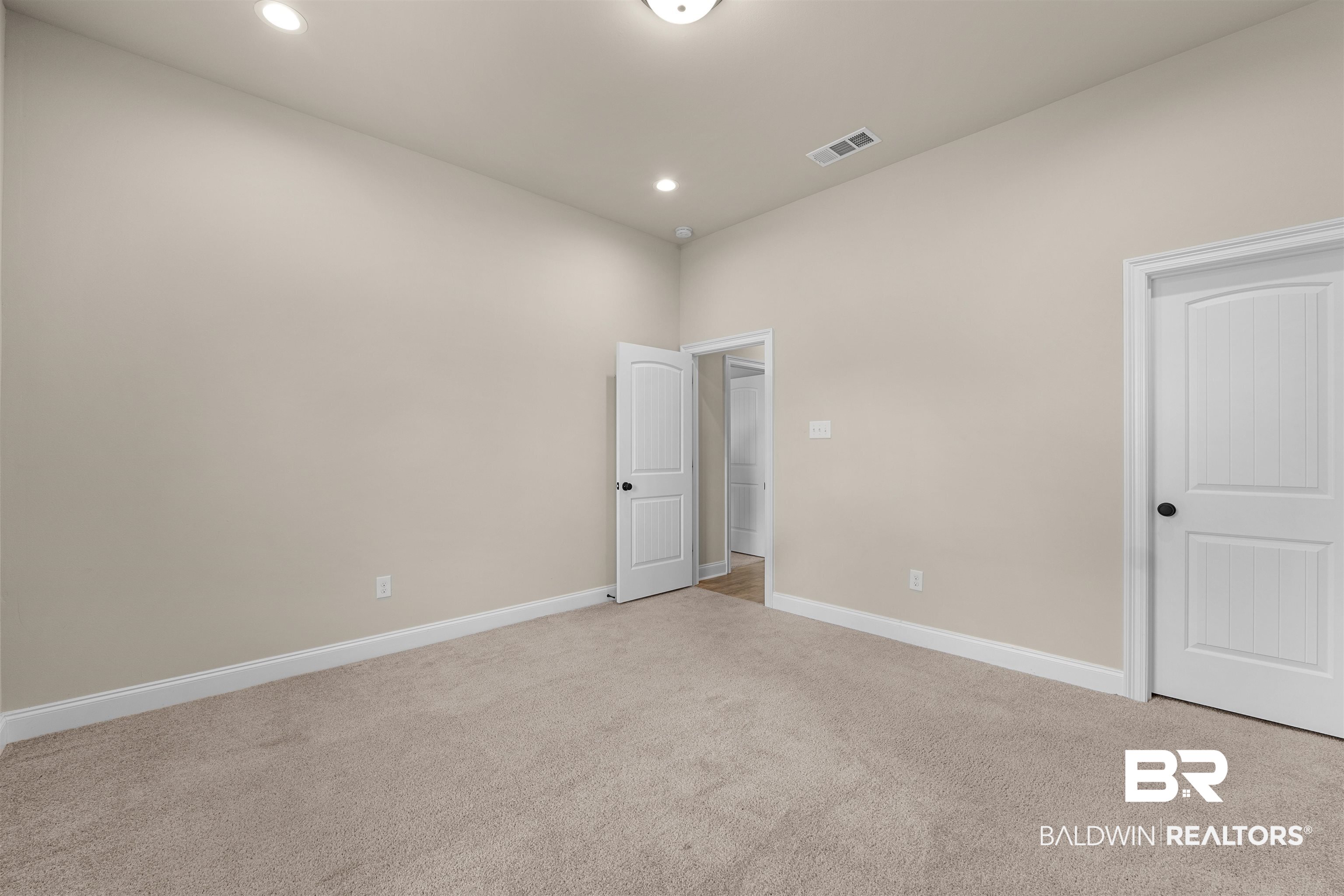 991 Dalton Circle Foley, AL 36535 - Photo 18 of 35 Unfurnished bedroom with light colored carpet and recessed lighting