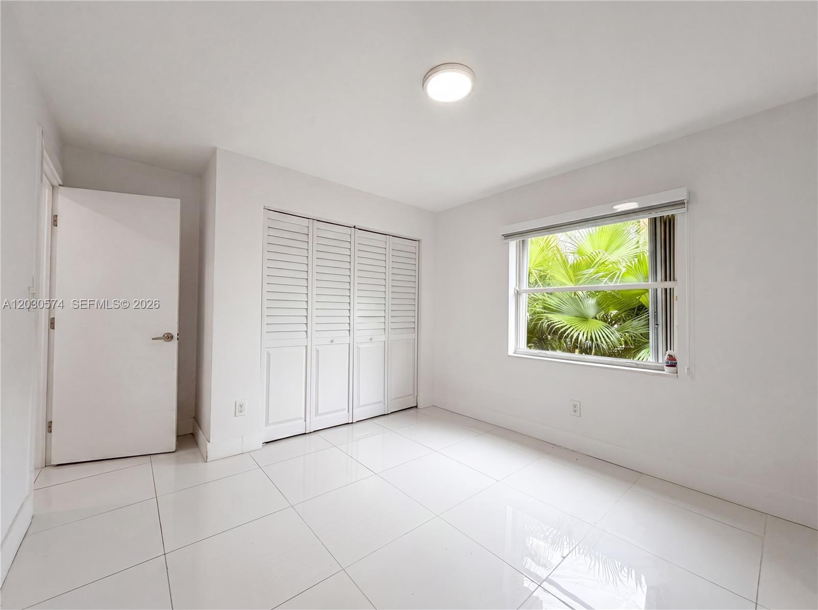 16571 Southwest 145th Avenue Miami, FL 33177 - Photo 18 of 25 an empty room with windows