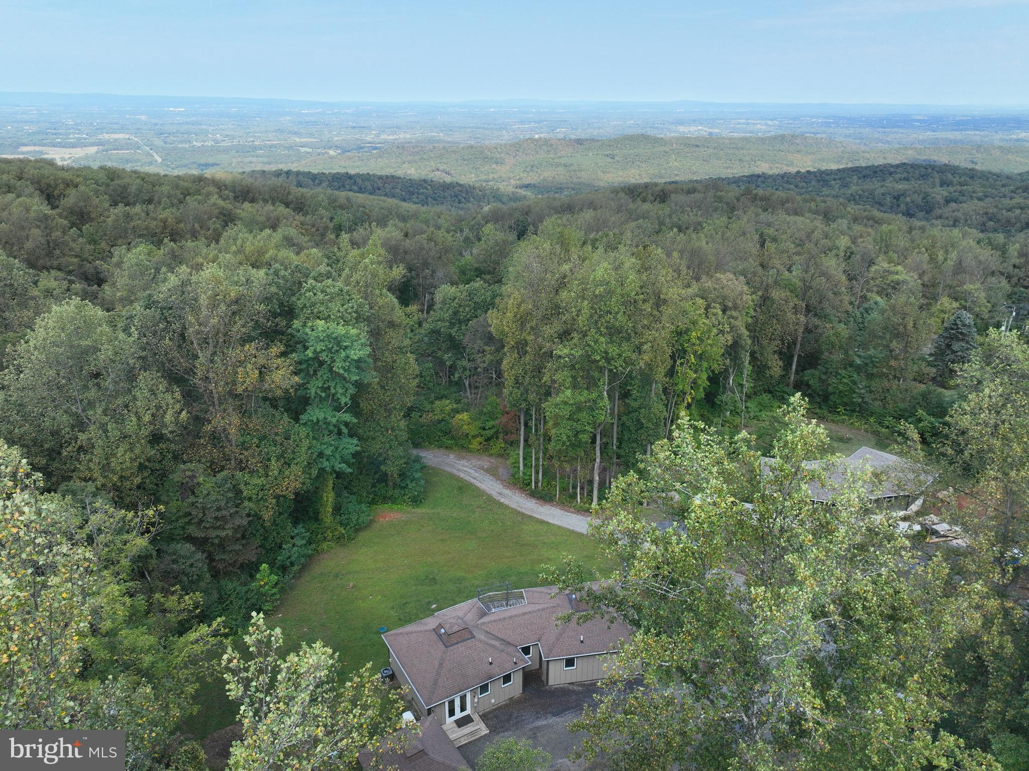21826 Blue Ridge Mountain Road Paris, VA 20130 - Photo 1 of 60 a view of a city with lush green forest