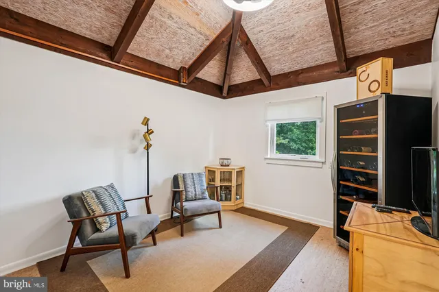 a view of a livingroom with furniture and a window