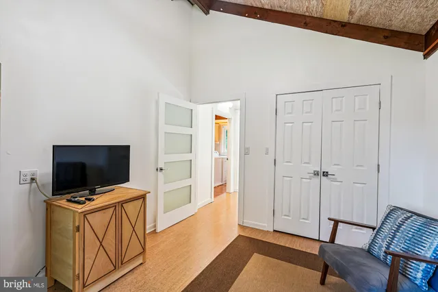 a kitchen with granite countertop cabinets stainless steel appliances a sink and window