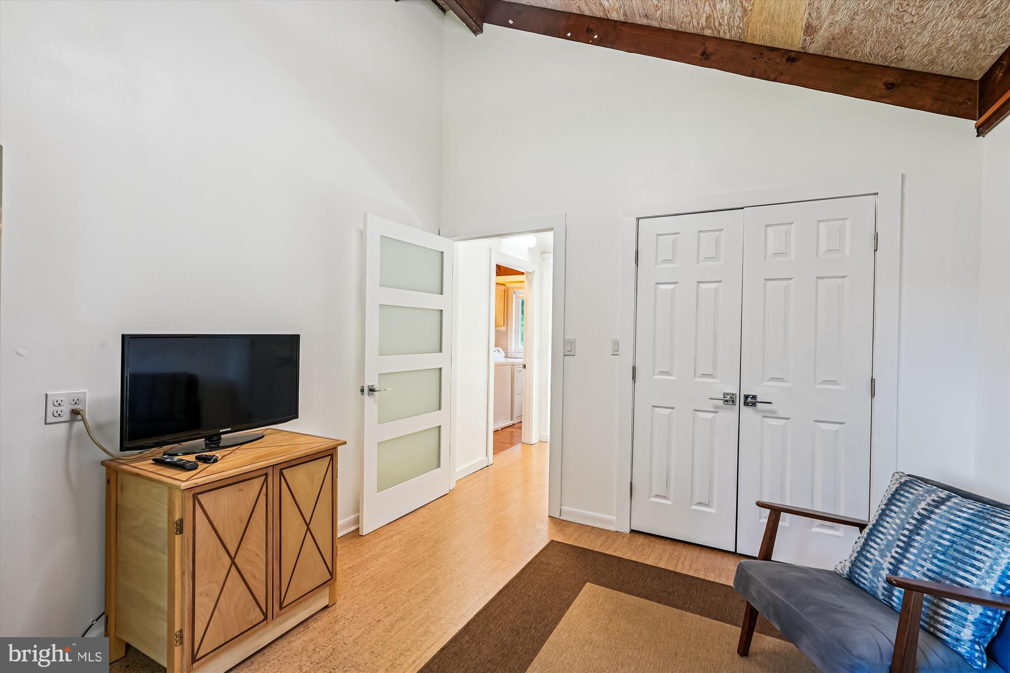 21826 Blue Ridge Mountain Road Paris, VA 20130 - Photo 18 of 60 a view of room with wooden floor and flat screen tv