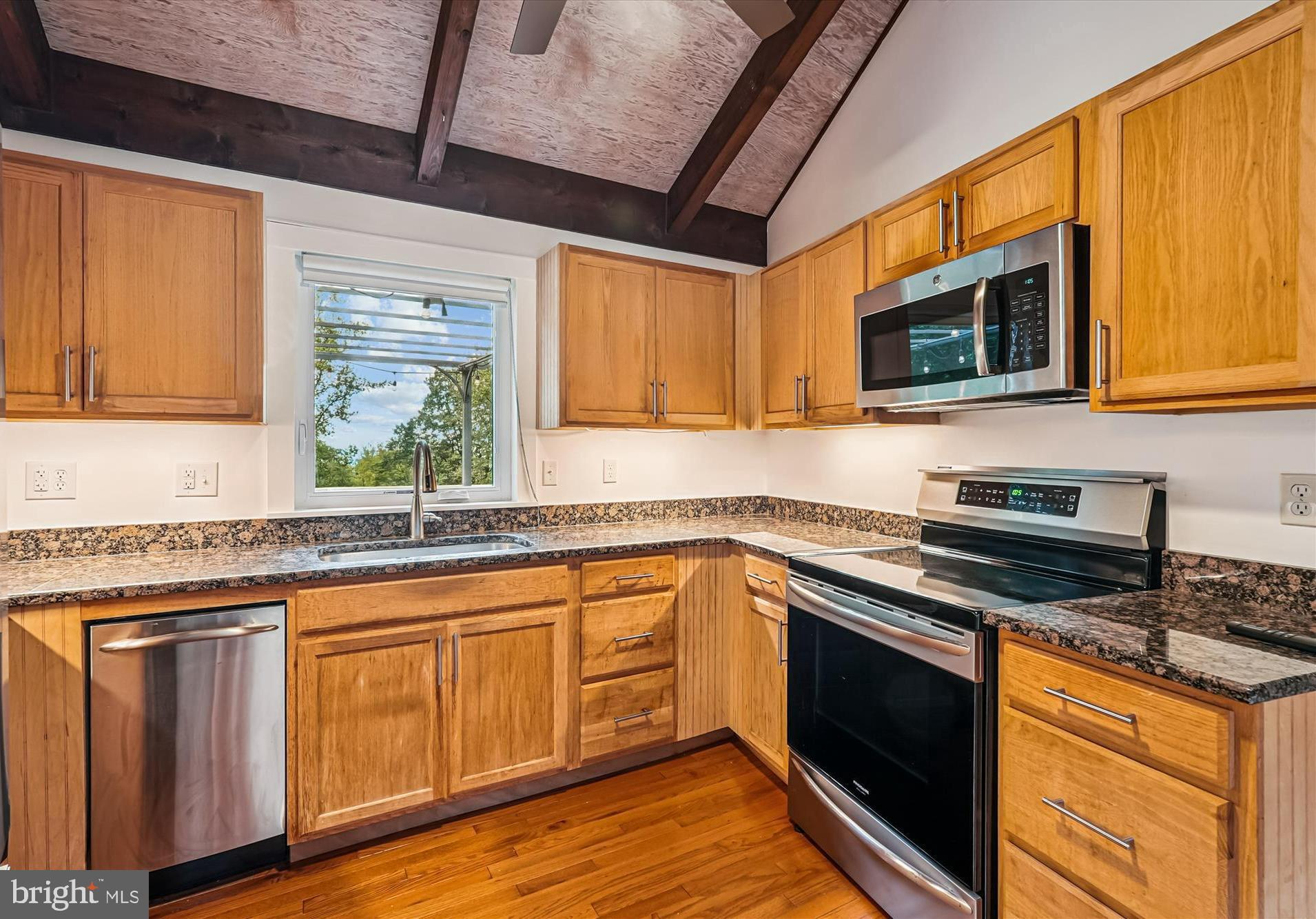 21826 Blue Ridge Mountain Road Paris, VA 20130 - Photo 19 of 60 a kitchen with granite countertop cabinets stainless steel appliances a sink and window