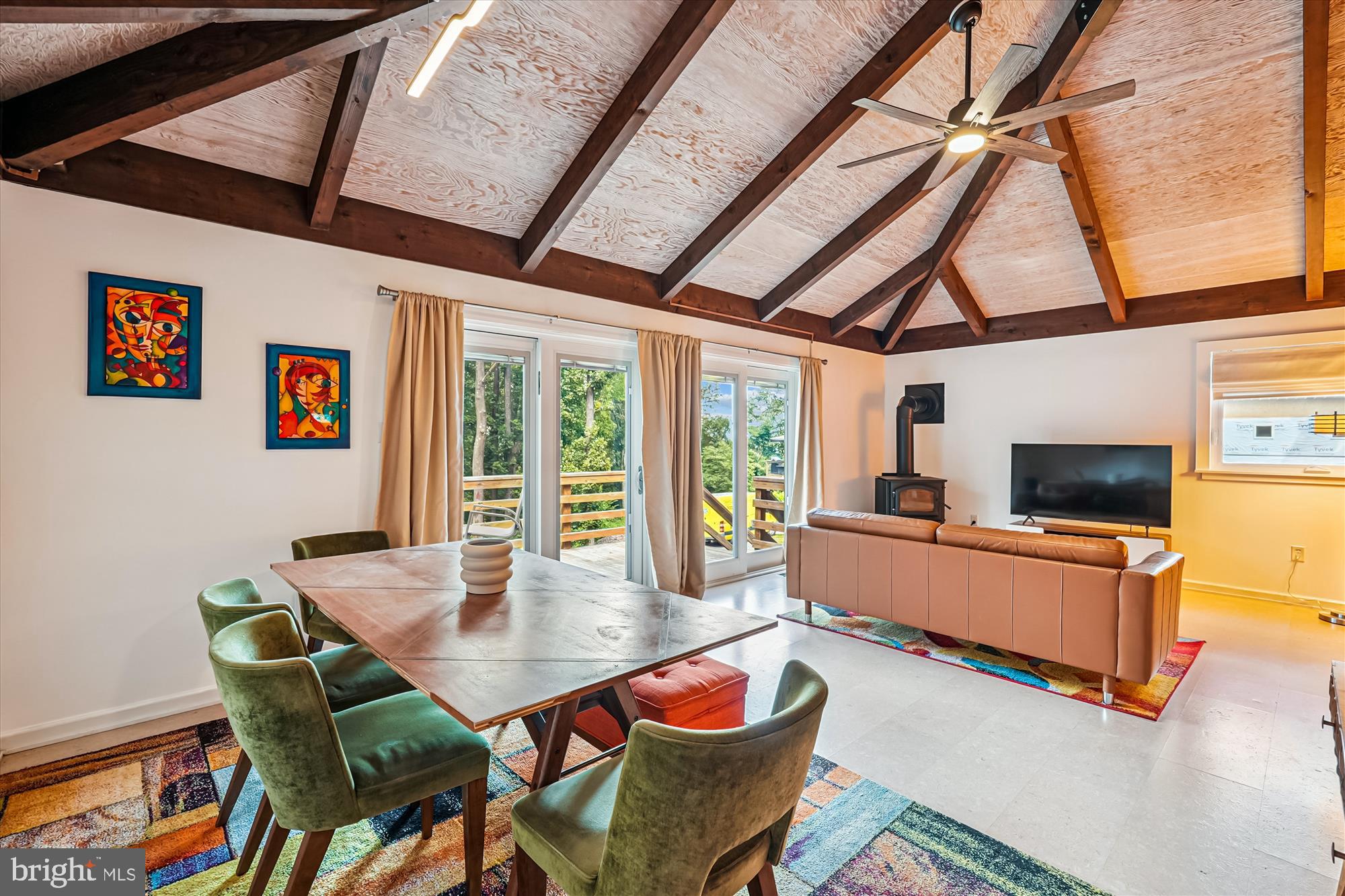 21826 Blue Ridge Mountain Road Paris, VA 20130 - Photo 26 of 60 a living room with furniture a flat screen tv and a large window