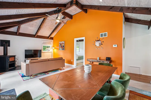 a living room with a flat screen tv and a couch