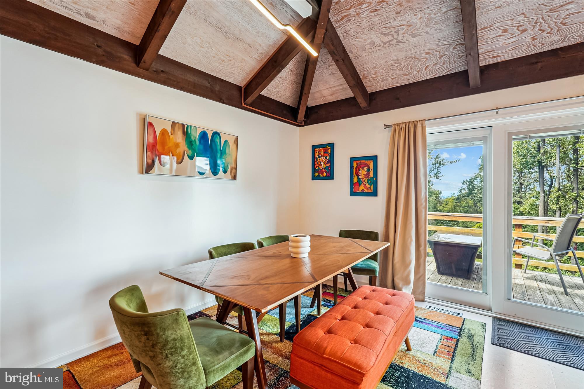 21826 Blue Ridge Mountain Road Paris, VA 20130 - Photo 29 of 60 a balcony view with a dining table and chairs with wooden floor