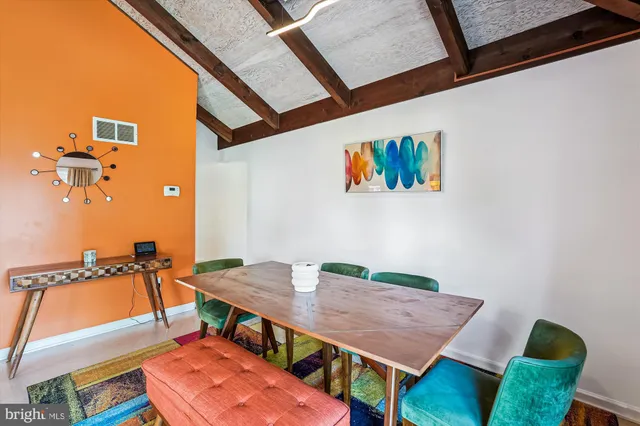 a view of a patio with table and chairs
