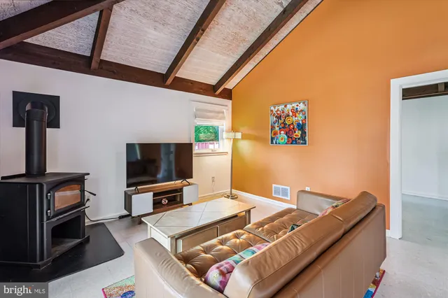 a bedroom with a bed and a ceiling fan