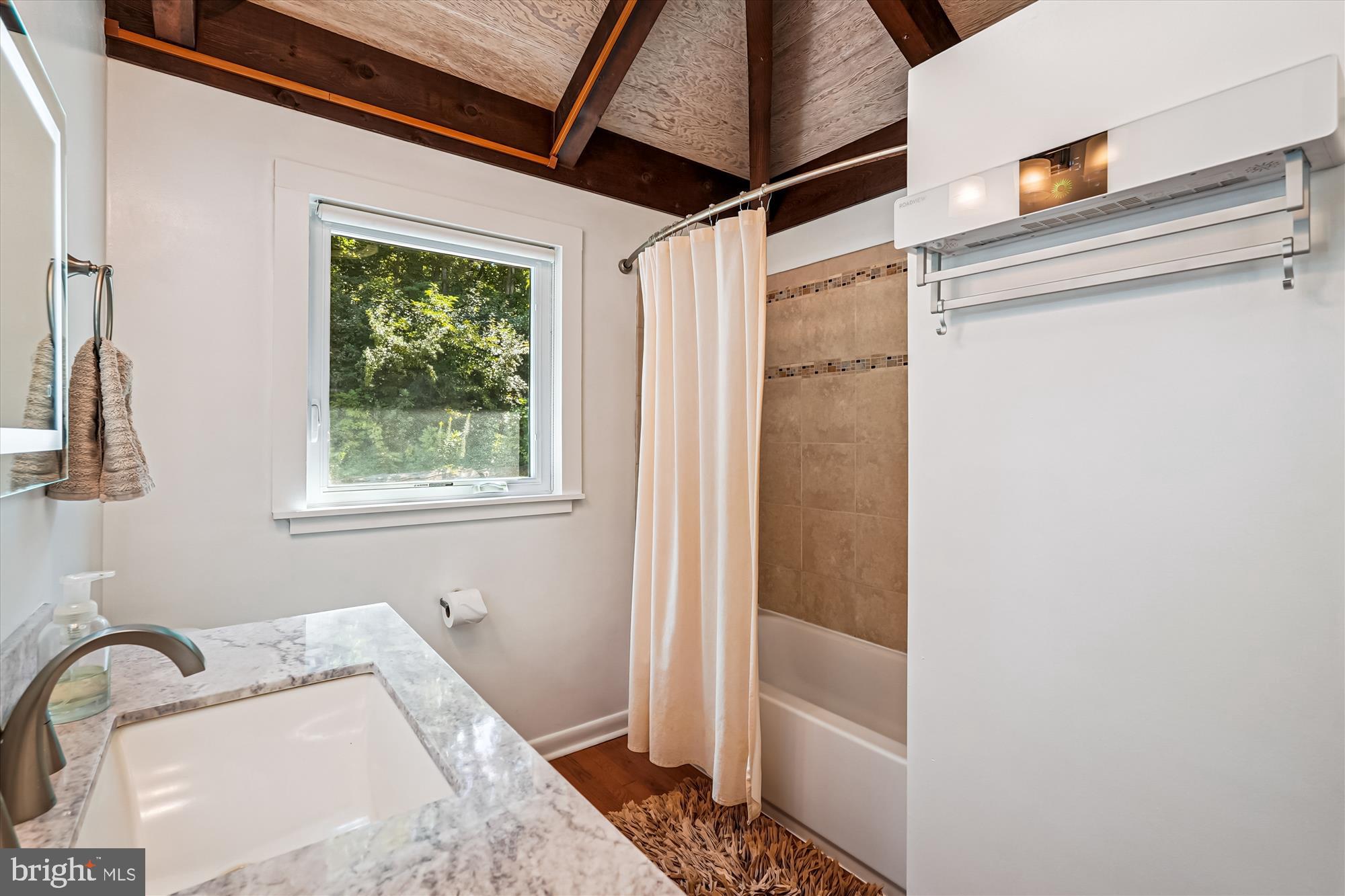 21826 Blue Ridge Mountain Road Paris, VA 20130 - Photo 40 of 60 a bathroom with a tub and shower