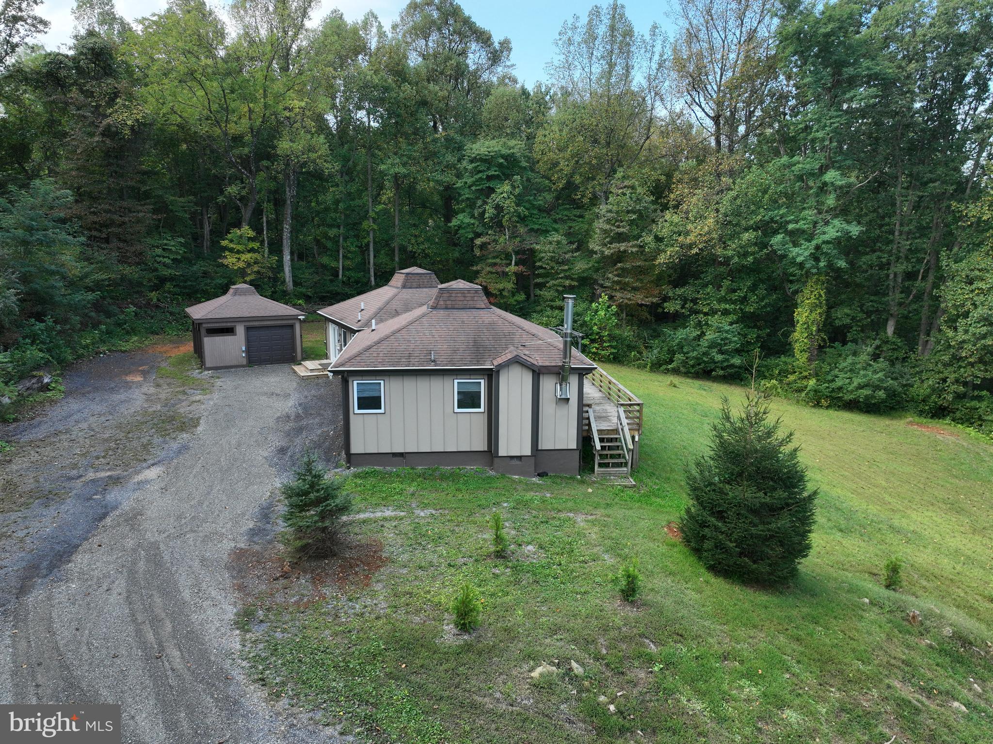 21826 Blue Ridge Mountain Road Paris, VA 20130 - Photo 56 of 60 a view of a house with a yard and large trees