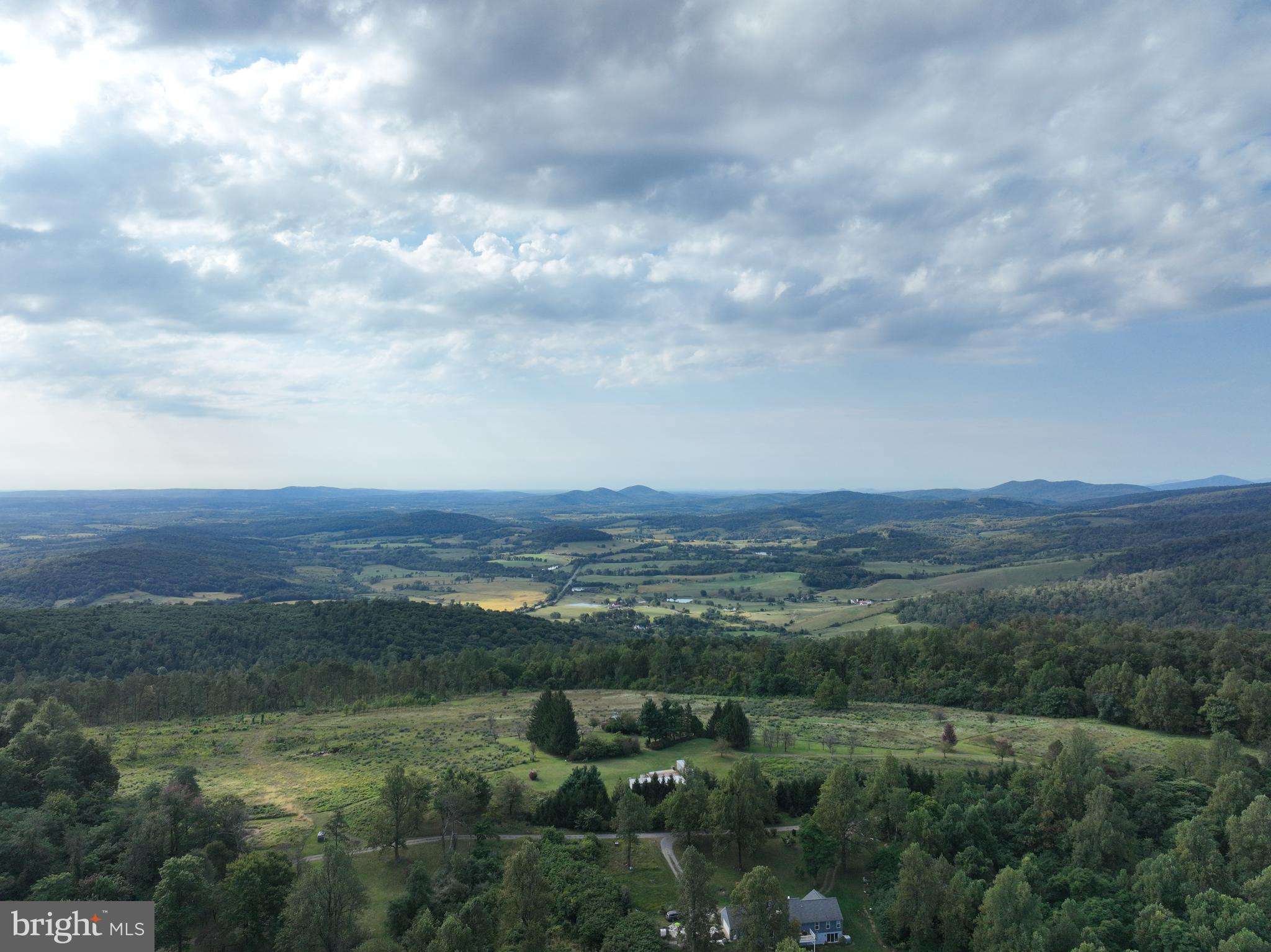 21826 Blue Ridge Mountain Road Paris, VA 20130 - Photo 8 of 60 a view of a field with mountains in the background
