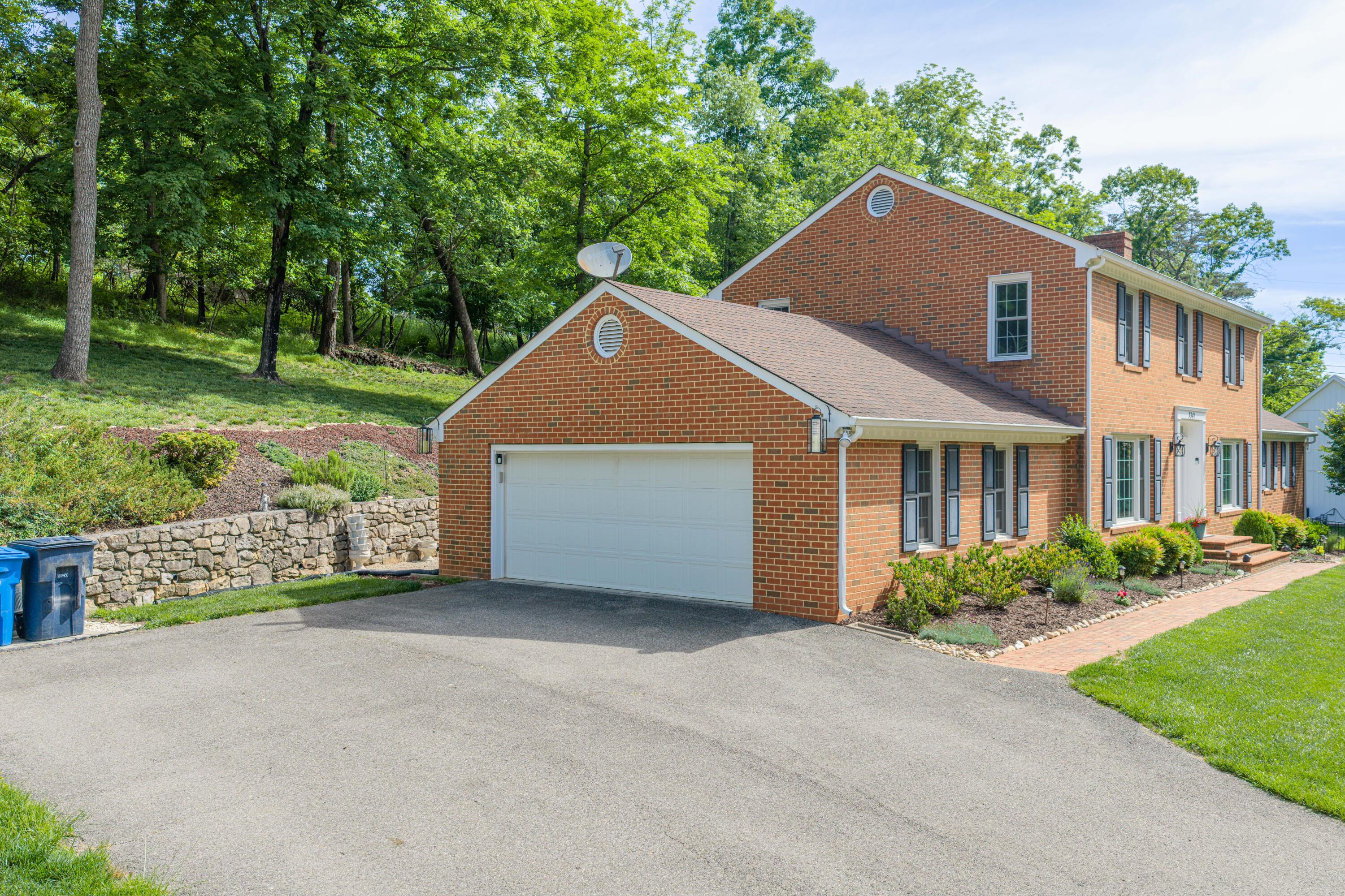 3341 Hidden Oak Road Southwest Roanoke, VA 24018 - Photo 3 of 26 a house with trees in the background
