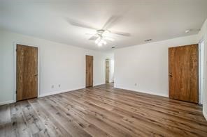 1111 Pecan Circle Seabrook, TX 77586 - Photo 17 of 31 a view of empty room with wooden floor and fan