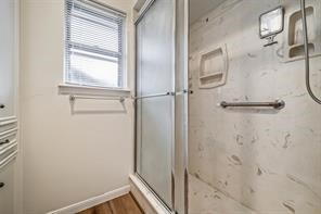 1111 Pecan Circle Seabrook, TX 77586 - Photo 19 of 31 a bathroom with a glass shower door