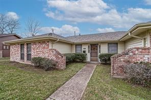 1111 Pecan Circle Seabrook, TX 77586 - Photo 2 of 31 a front view of a house with garden