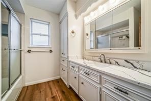 1111 Pecan Circle Seabrook, TX 77586 - Photo 26 of 31 a bathroom with a double vanity sink and mirror