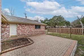 1111 Pecan Circle Seabrook, TX 77586 - Photo 29 of 31 a view of a backyard with wooden fence
