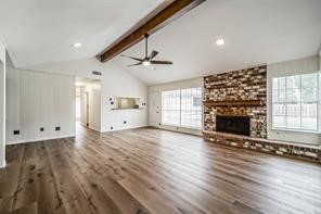 1111 Pecan Circle Seabrook, TX 77586 - Photo 7 of 31 a living room with hard wood floors and a fireplace