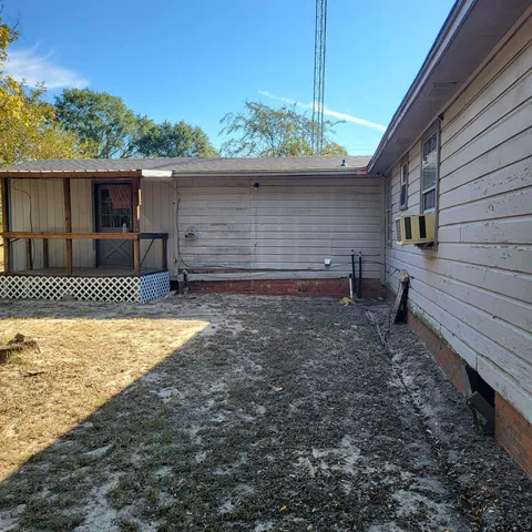 a backyard of a house with lots of green space