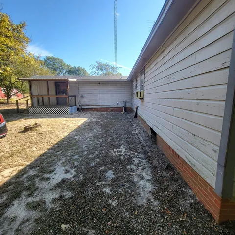 a view of a backyard of a house