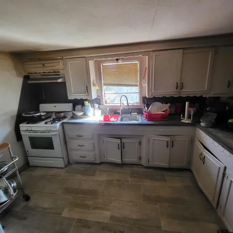 a view of a storage & utility room with two washing machine