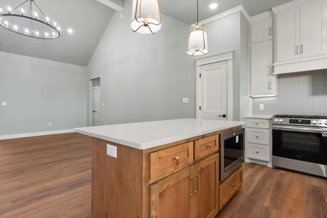 a kitchen that has a lot of cabinets in it