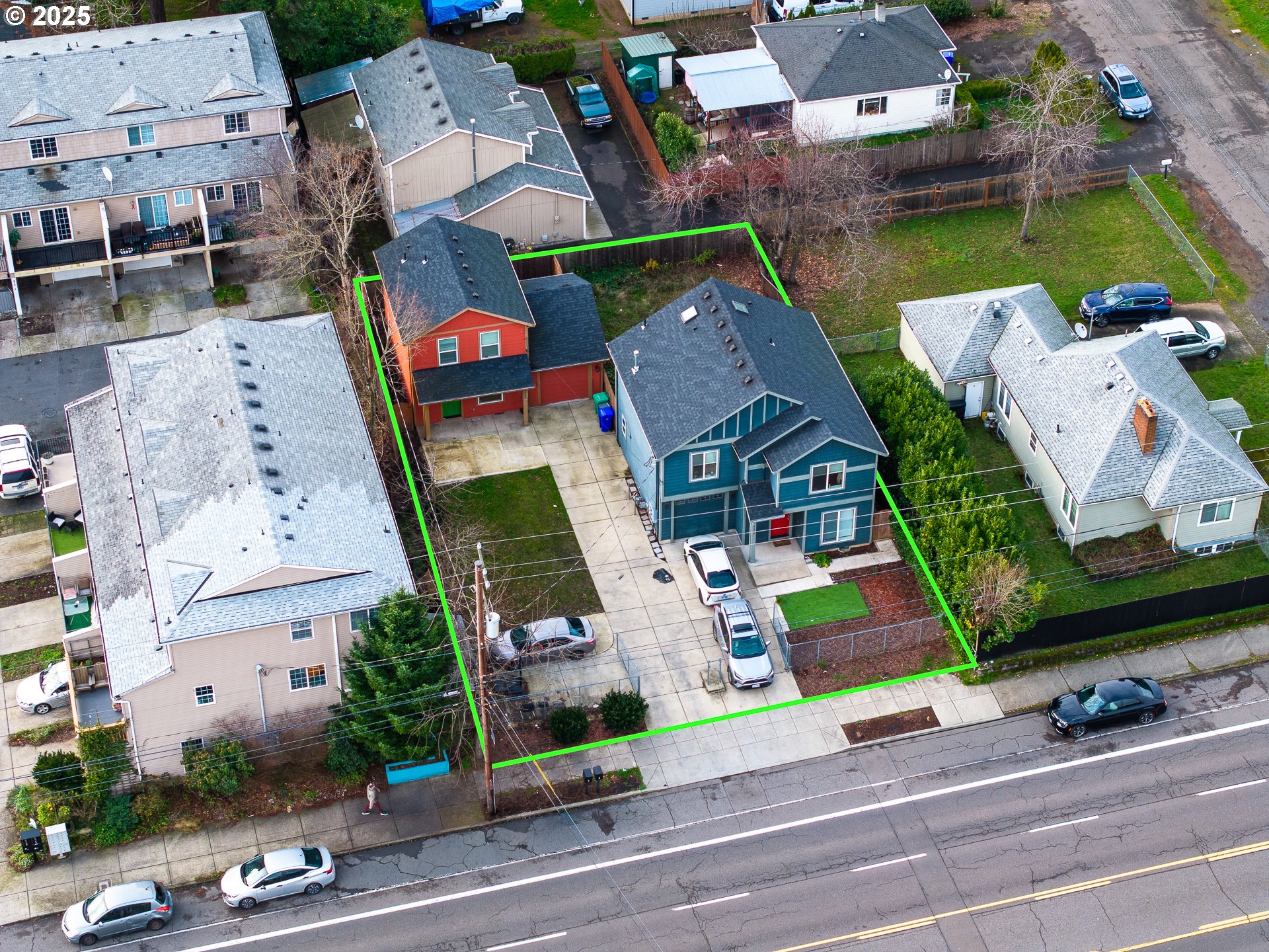 an aerial view of a houses with yard