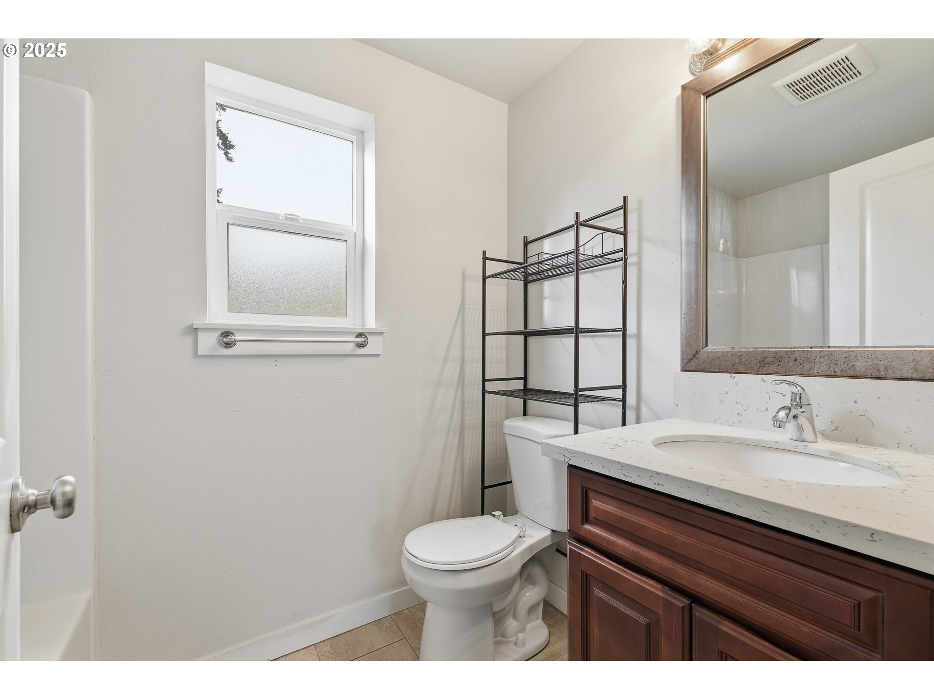 3223 Southeast 122nd Avenue Portland, OR 97236 - Photo 12 of 21 a bathroom with a toilet a sink and mirror