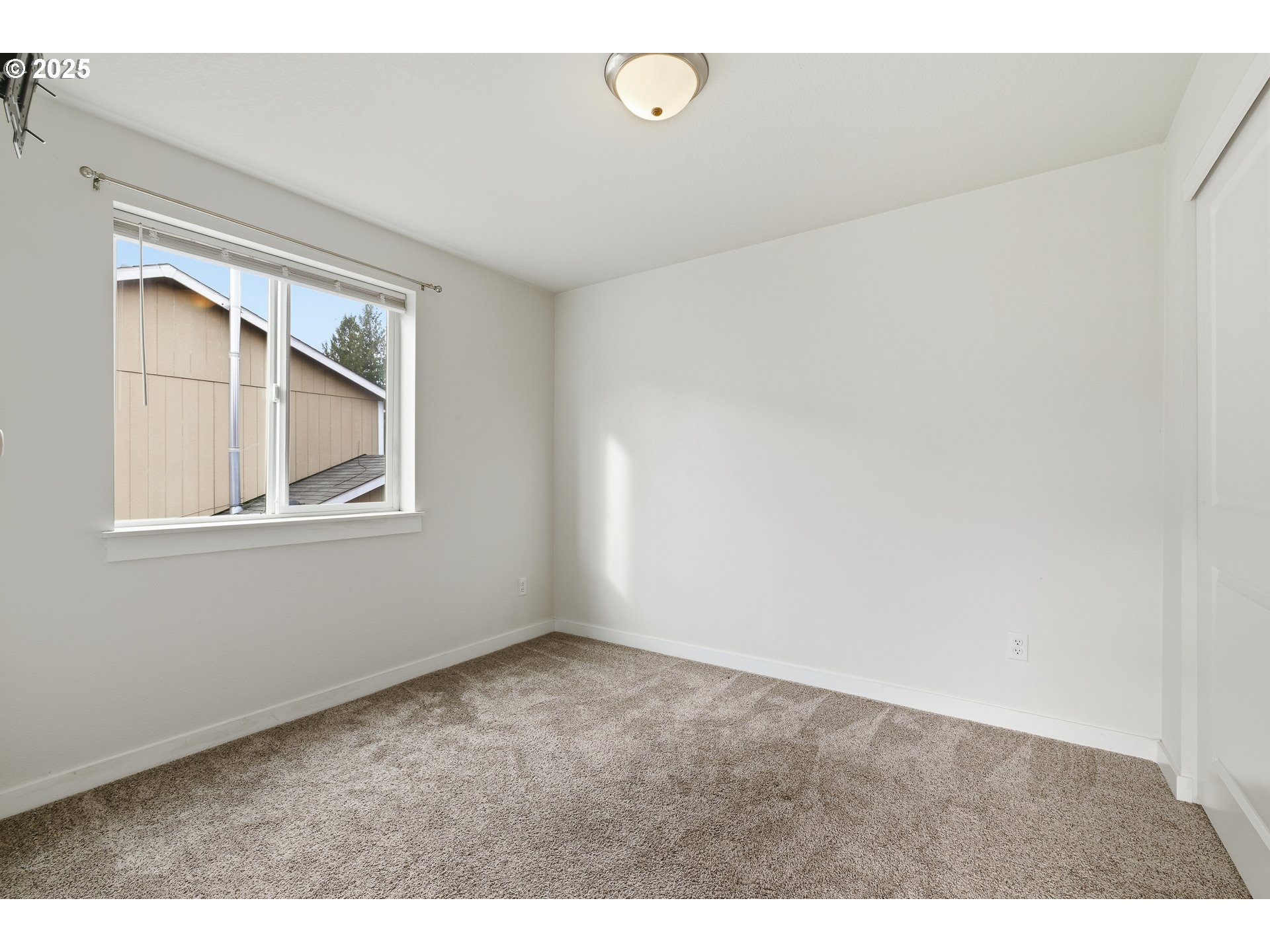 3223 Southeast 122nd Avenue Portland, OR 97236 - Photo 14 of 21 a view of an empty room with a window