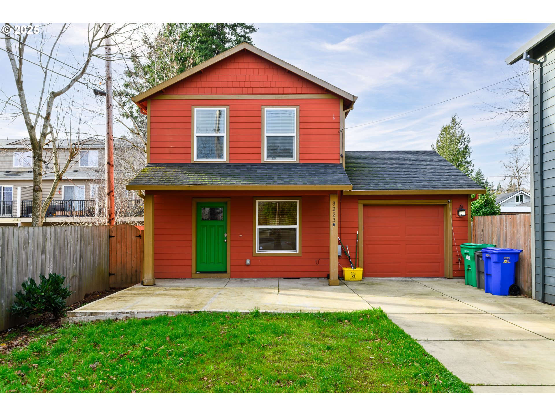 3223 Southeast 122nd Avenue Portland, OR 97236 - Photo 3 of 21 a view of a yard in front of a house with plants