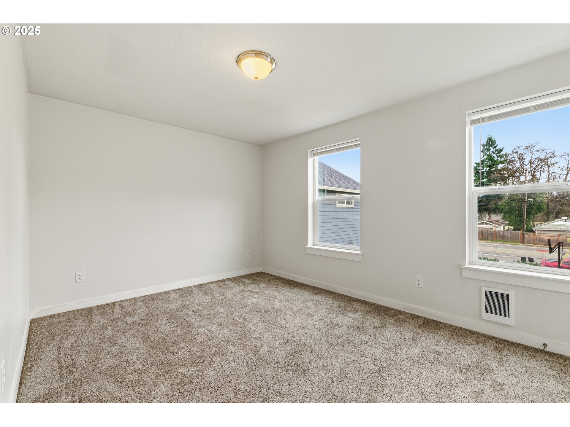 3223 Southeast 122nd Avenue Portland, OR 97236 - Photo 10 of 21 a view of an empty room with a window